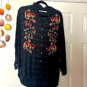 Embroidered shirt on check shirt.